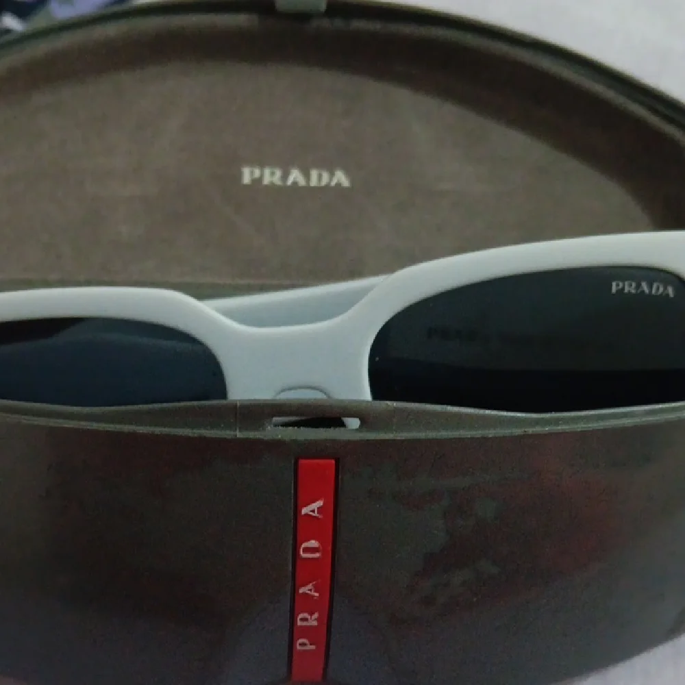 Prada Gray Sunglasses with Dark Lenses - Picture 9 of 10